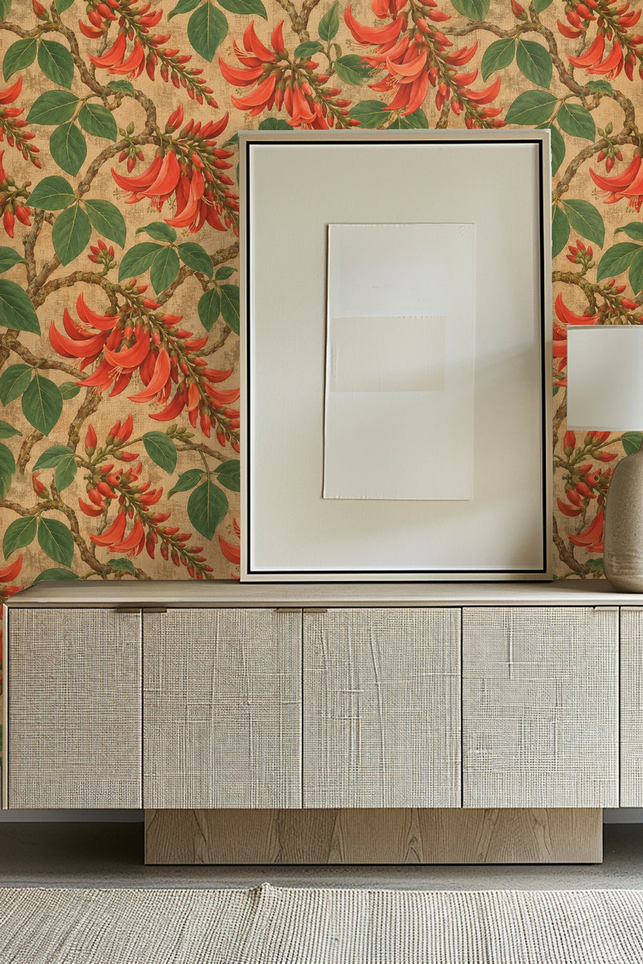 Press Esc coral floral wallpaper shown above a woven-front console in a styled room
