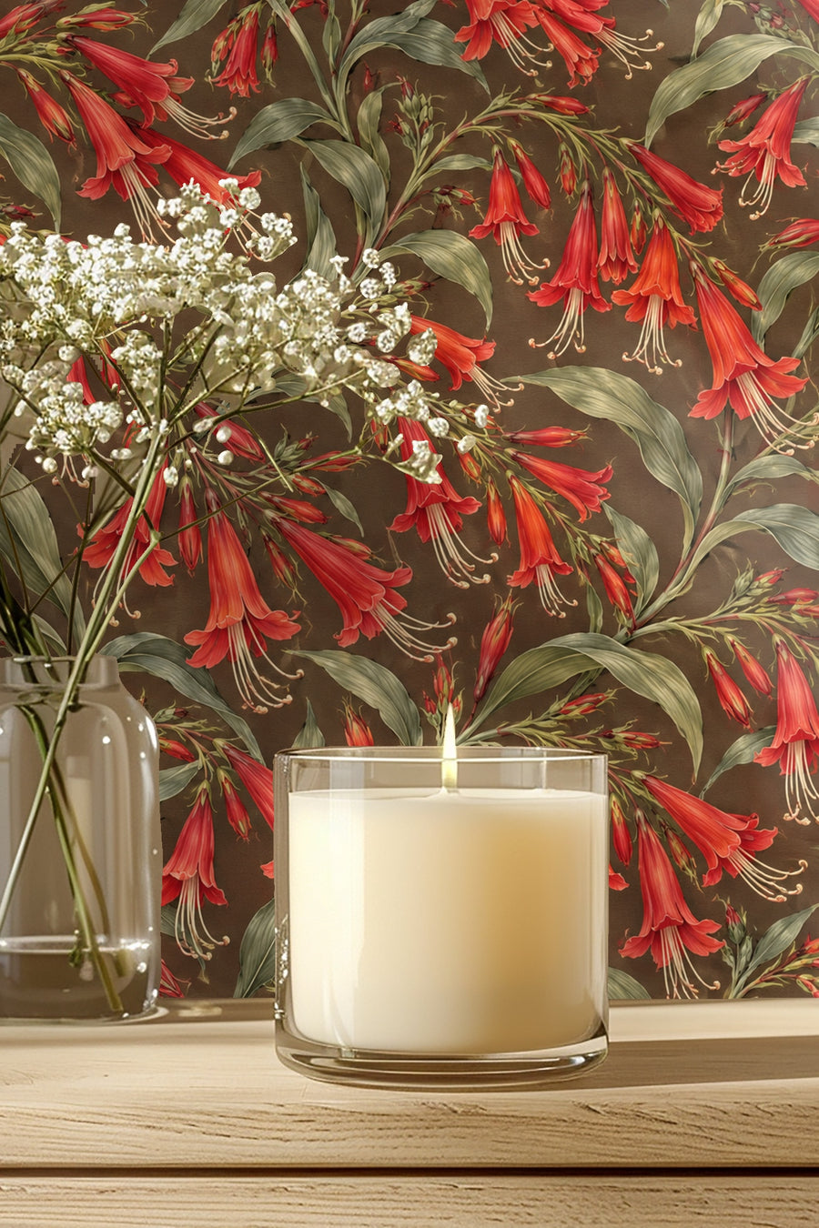 Press Esc scarlet floral wallpaper with olive leaves behind a candle and side table