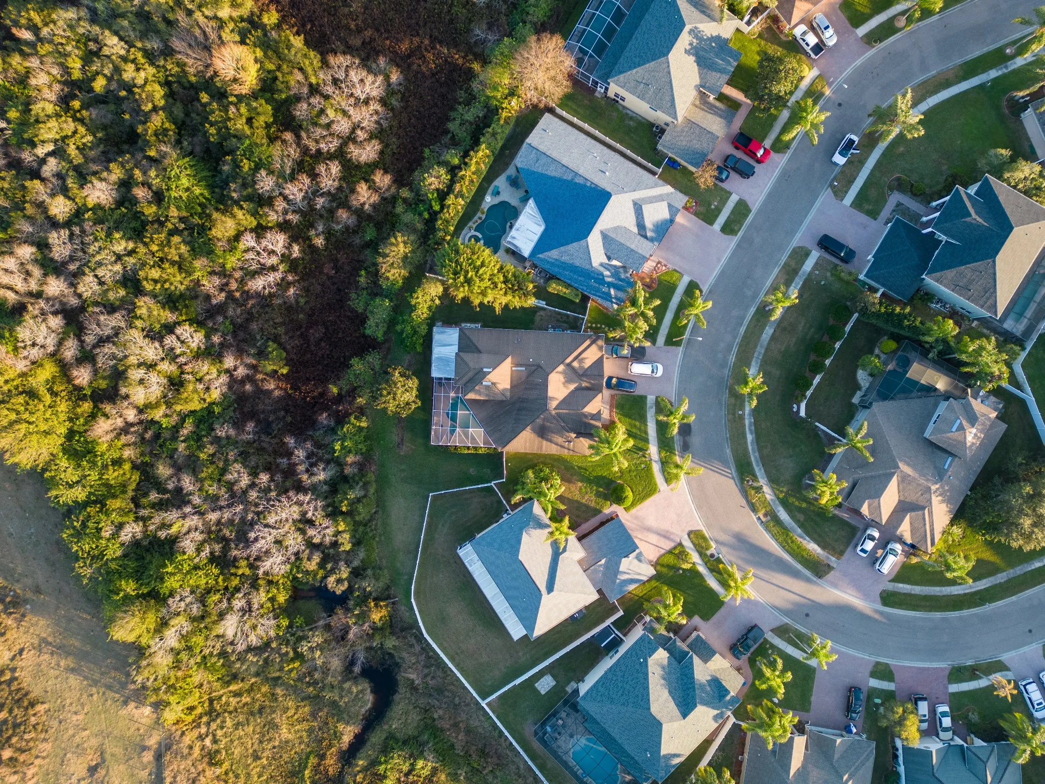 Aerial view of homes beside open land
